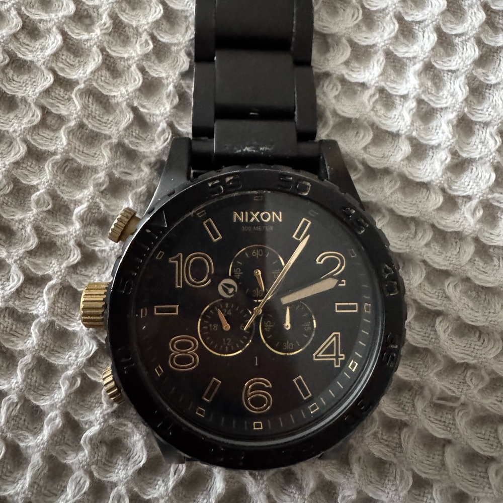 Nixon Black and Gold Watch
